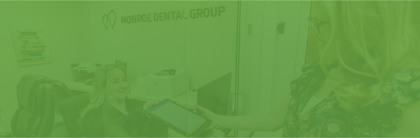 Monroe Dental Group team providing care in a treatment room