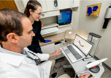 Dental implant and full-mouth restoration treatment at Monroe Dental Group